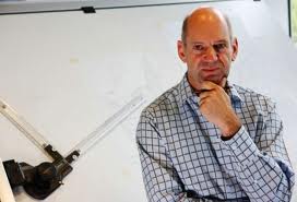 Adrian Newey in relaxed pose.